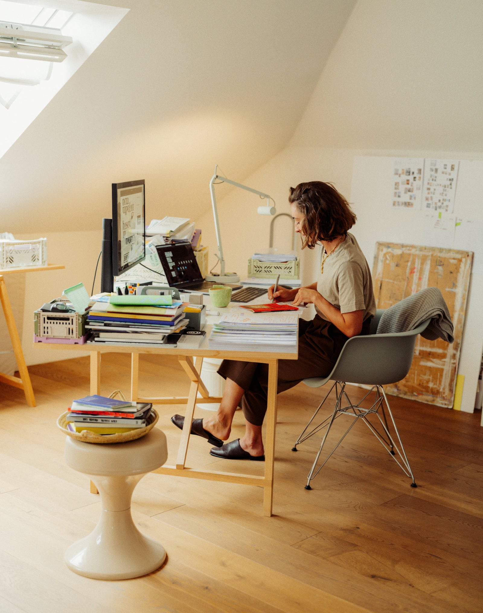 Person working at a desk in a home office setting