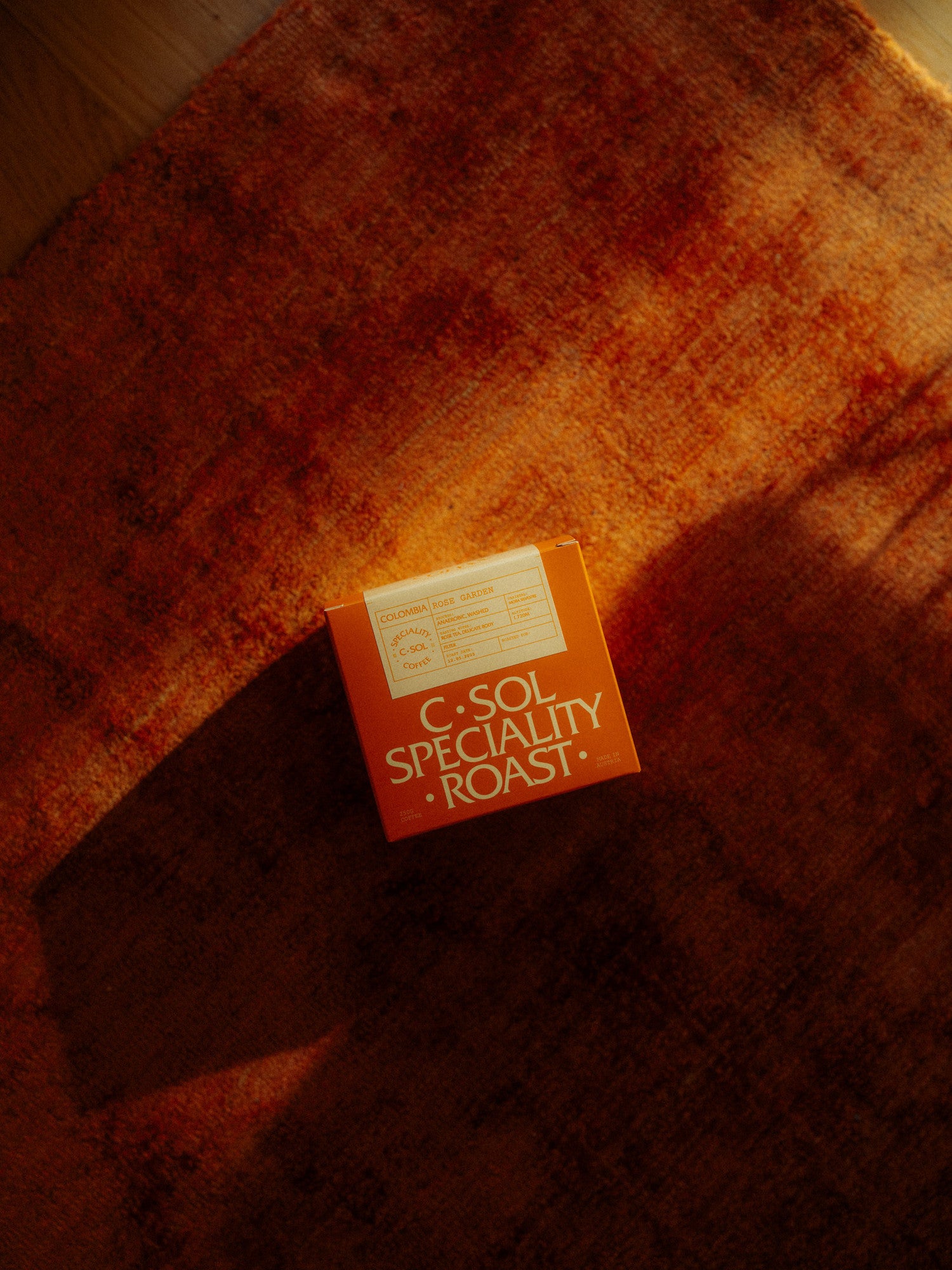 Box of C-Sol Specialty Roast coffee on a textured surface